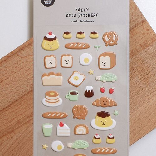 A closer view shows pudding, toast faces, bread, eggs, coffee, cake, fruit, and other individual illustrations across the sheet.