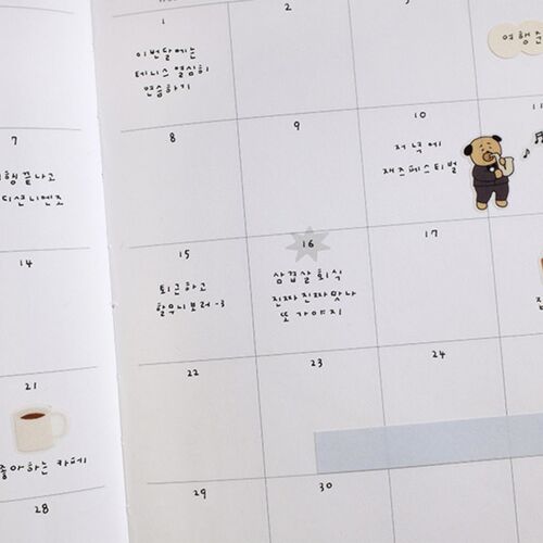 Starburst stickers appear arranged across a large monthly planner page, adding gentle color without covering handwritten plans.