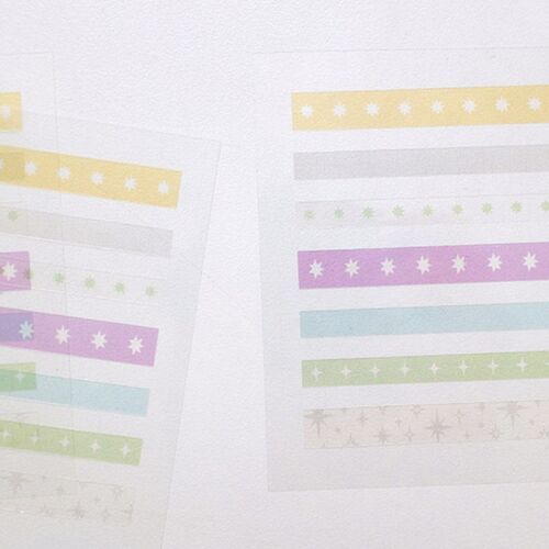 Several sticker sheets are spread out together, showing the collection’s varied starburst sizes and soft pastel color balance.