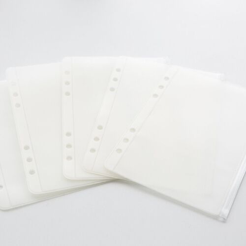 Five transparent pockets are fanned out together, showing the matching six-hole edges and compact refill format.
