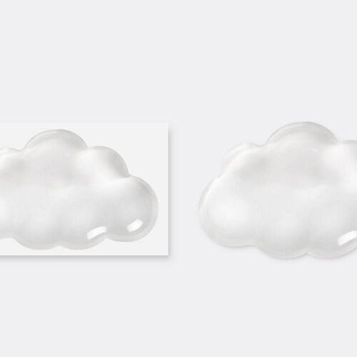 Packaging beside the cushion identifies it as a clear cloud wrist rest and shows the same smooth, softly rounded profile.