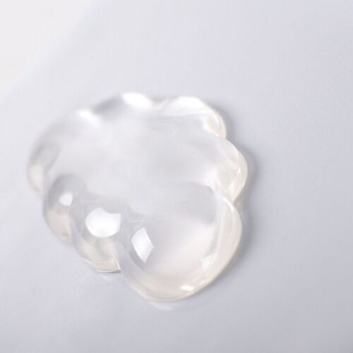 This angled view emphasizes the glossy transparent finish, curved edges, and cloud contours across the compact wrist support.