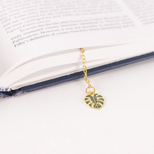 Rose bookmark card features red blooms, green leaves, gold outlines, and a small matching rose charm.