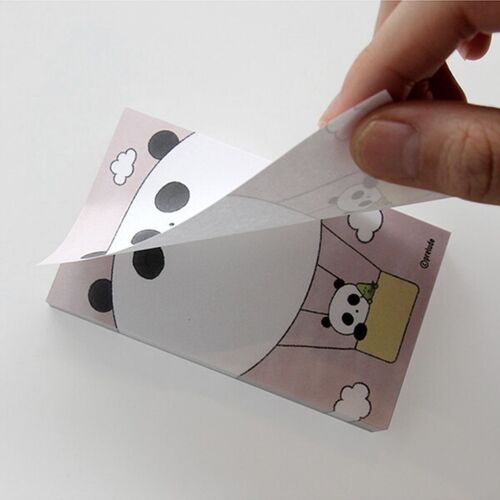 A hand lifts a non-adhesive sheet from the Hot Air Balloon design, showing the easy tear-off format and panda artwork.