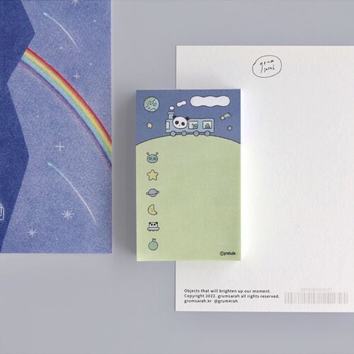A completed Space Trip sheet shows handwritten notes arranged across the illustrated pale green writing area.