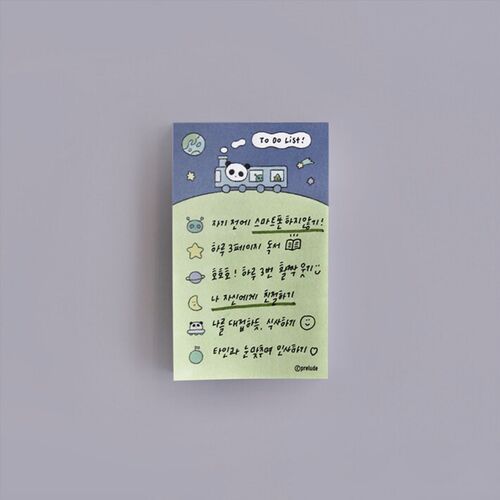 The Moon Dream design rests beside an open notebook and panda sticker, with a panda reclining on a crescent moon.