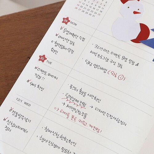 A handwritten weekly layout combines schedule notes, highlighted reminders, and sticker accents across the dated columns.