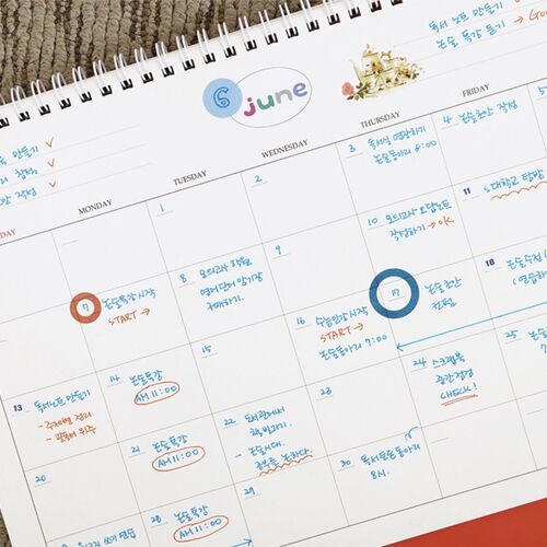 The October page is shown with handwritten notes, colored marks, and decorative stickers used to separate tasks.