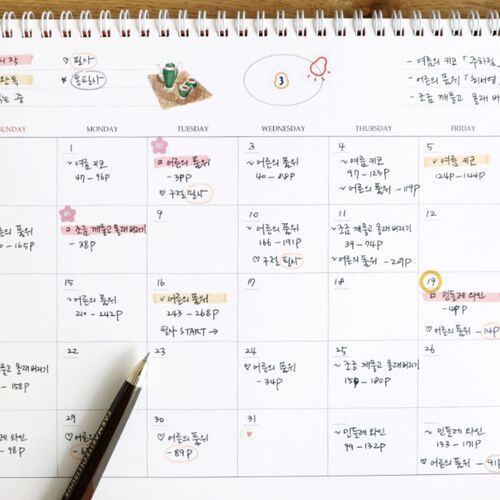 A close-up of the October grid shows detailed handwriting, bright circular markers, and clear weekday headings.