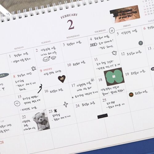 The February page includes personal notes, small stickers, and a Prince Story illustration near the lower corner.