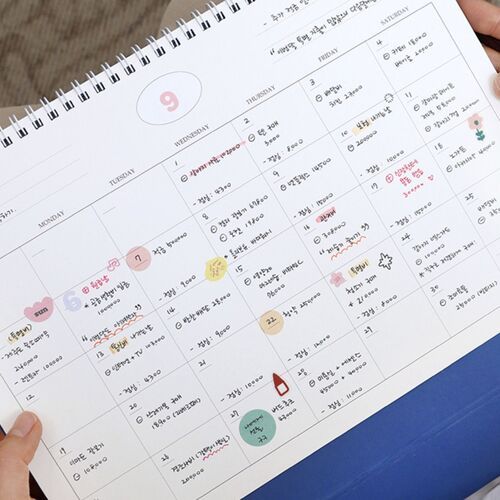 The February layout is filled with handwritten entries and decorative marks, showing the page’s practical writing area.