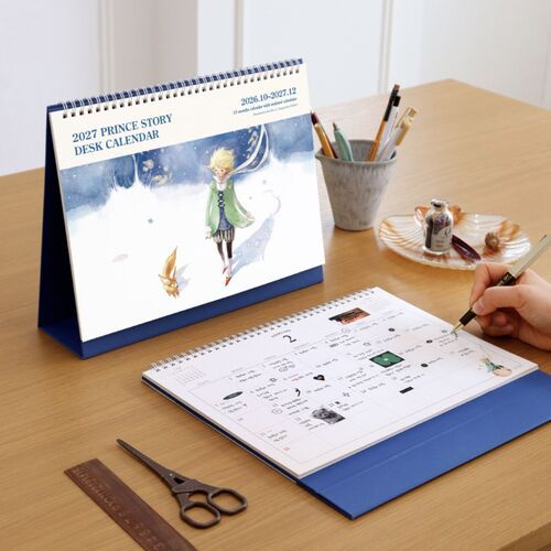 The blue-backed scheduler is positioned near a window and tableware, showing its stable standable format.