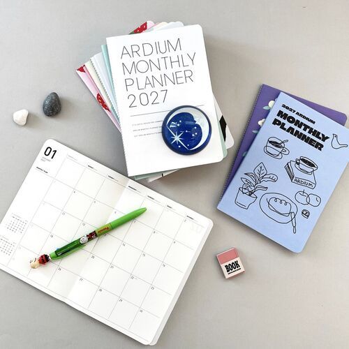The Original planner lies open to a clean monthly calendar with ample boxes for appointments, notes, and reminders.