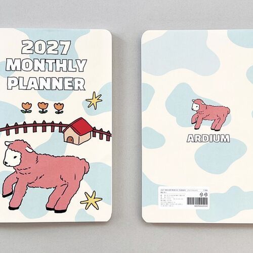 The yearly plan spread organizes all twelve months in compact sections for an at-a-glance overview.