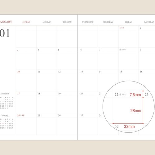 Two Green Mousse schedulers overlap on a wood desk, displaying their embossed year marks and title bands.