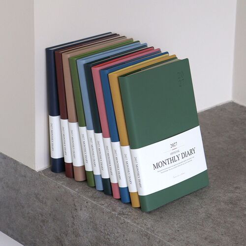 Decorative journaling pages combine lined writing space with room for photographs and keepsakes.