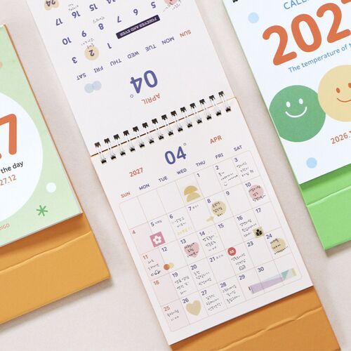 Photo 7: The calendar displays a May page with colorful date numbers, decorative marks, and room for handwritten notes.