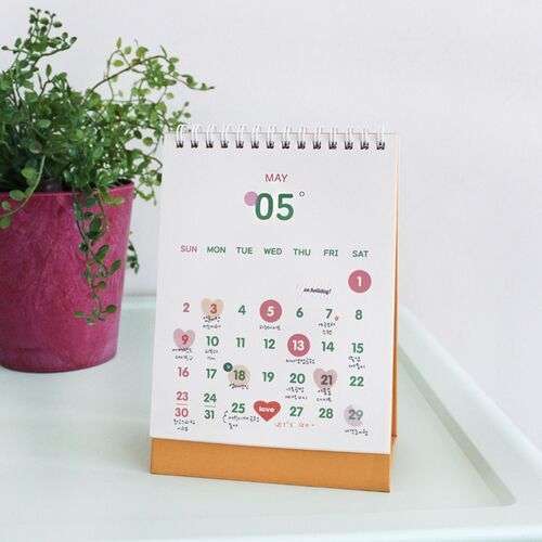 Photo 9: An open July spread shows two page layouts, including a spacious monthly grid and a simpler date arrangement.