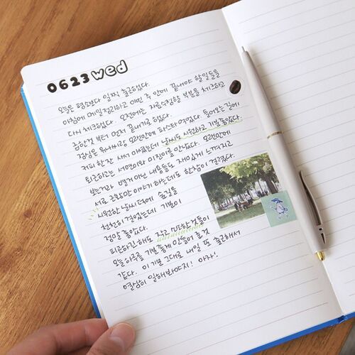 A lined spread is filled with handwriting and a small photo, showing how the notes section can support journaling.