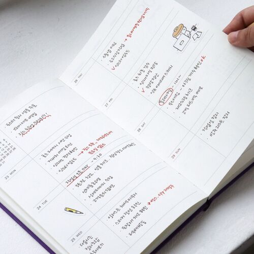 A decorated note spread pairs handwritten entries with small illustrations and photo accents for a personal journal style.