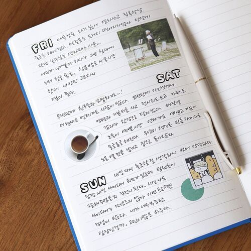 A purple planner is held against a white shirt, emphasizing the solid-color cover and compact handheld size.