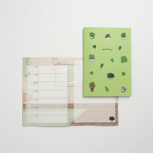 Houseplant’s green cover features potted plants and leaves while the open spread carries a soft botanical background.