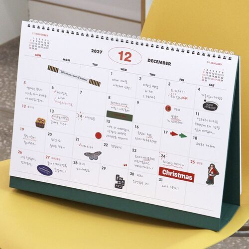 A filled July spread demonstrates how daily appointments, reminders, and handwritten details fit inside the monthly boxes.