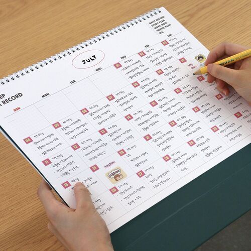 Two matching calendar views are arranged on a shelf, highlighting the substantial B4 footprint and tabletop presentation.