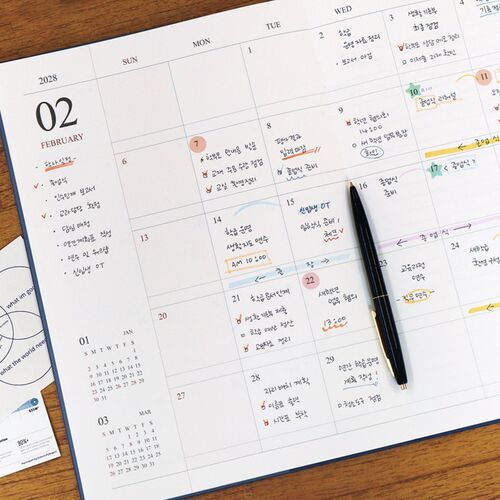 A close-up of the monthly grid shows clear weekday headers, date numbers, and room for multiple entries.