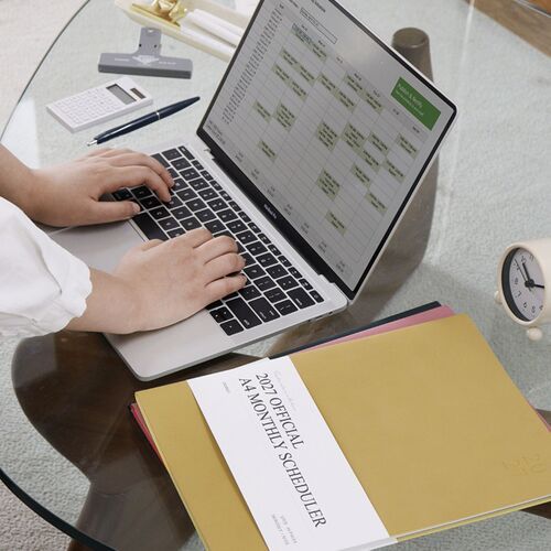 The Mustard scheduler is placed over other color options, showing the soft PU cover and contrasting white title band.