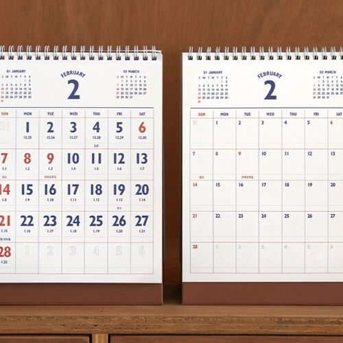 Two calendars are displayed together to show the clear monthly format and consistent brown foldout bases.