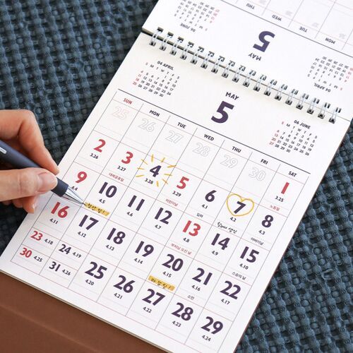 A decorated December page demonstrates how stickers, notes, and small illustrations can personalize the monthly layout.