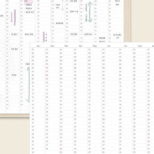 Several color options sit neatly on white shelving, showing how the planners look together in a tidy workspace.