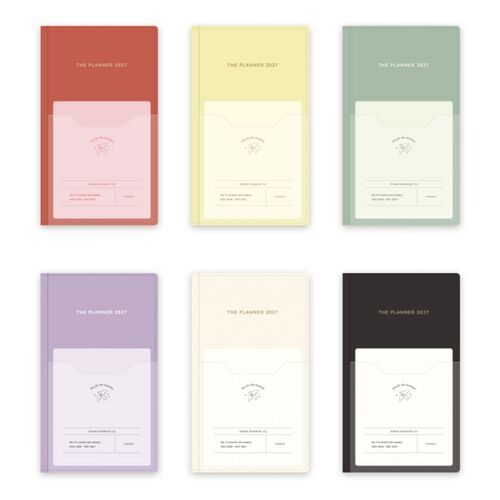 Butter is placed beside a smartphone to show the planner’s compact footprint and two ribbon bookmarks.