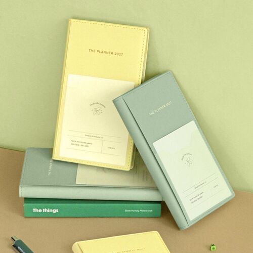 Butter and Cream Mint planners are shown together, highlighting their soft covers and compact vertical format.