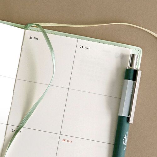 The Butter cover is photographed open beside a large smartphone, giving a clear visual sense of its size.