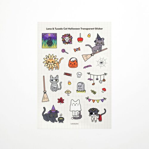 A transparent Halloween sheet is photographed flat, highlighting the clear-looking background around cats, brooms, tombstones, and festive banners.