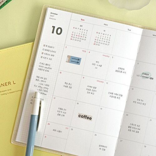 A close view of an October 2027 spread shows spacious date boxes, small reference calendars, and note areas.