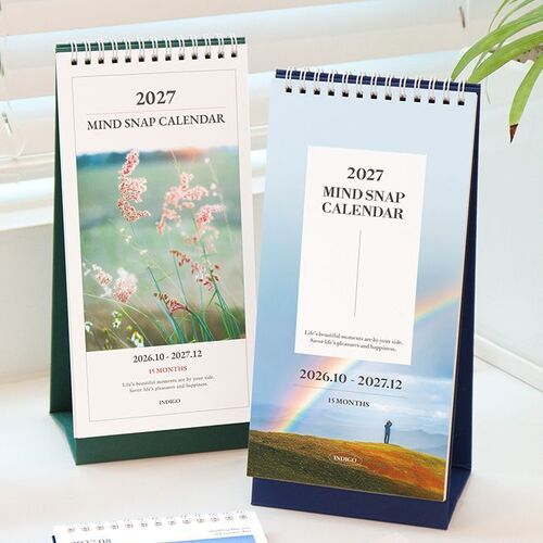 Both cover options are displayed against bright blinds, making the contrasting green and navy bases easy to compare.