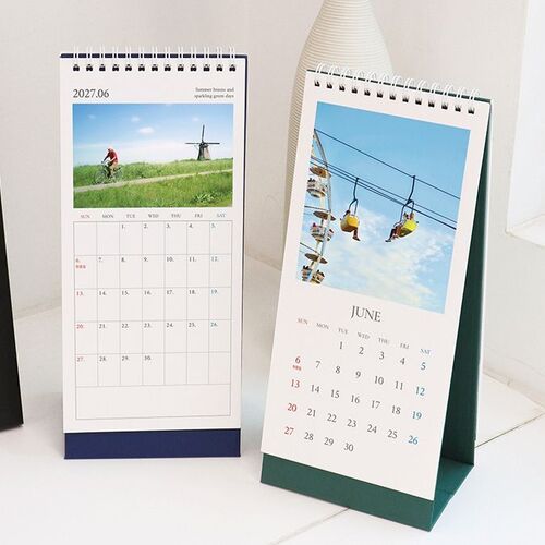An open monthly page displays a June calendar beside the standing calendar, highlighting the tall portrait format and easy viewing.