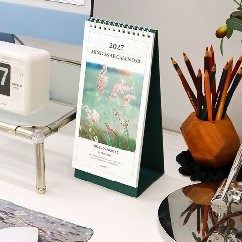 The Flower option sits beside colored pencils, showing its floral cover, green base, and compact upright desk profile.