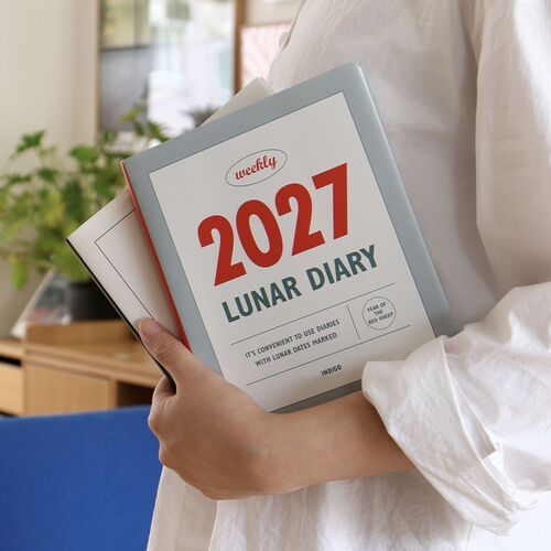Yearly calendar pages for 2027 and 2028 provide a compact reference spread across the open planner.