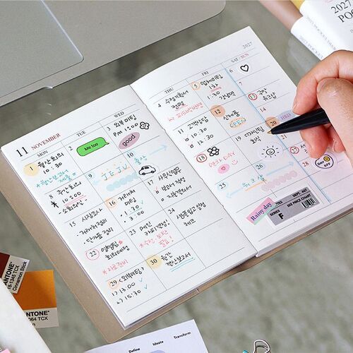 An open November monthly spread shows generous dated boxes used for appointments, tasks, and handwritten reminders.