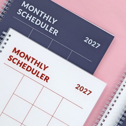 Navy and White planners are displayed with colorful stationery, showing how the large format fits planning supplies.