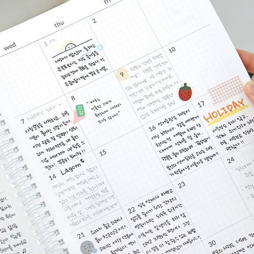 The close-up monthly view shows weekday labels, light graph lines, and generous boxes for written reminders.