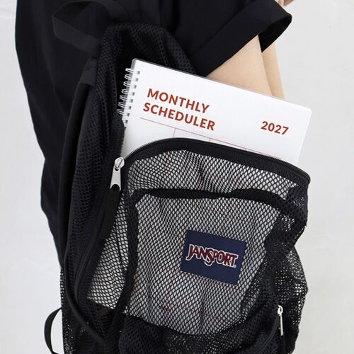 The Navy planner rests beside a White version, making the two available cover styles easy to compare.