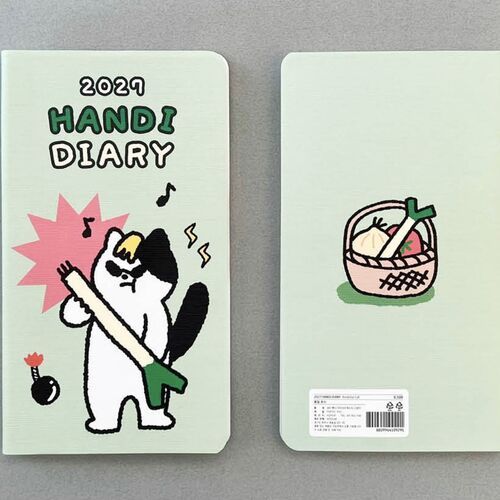 Triplet Cats has a pink striped cover with three black-and-white cats peeking into view beside scattered paw prints.
