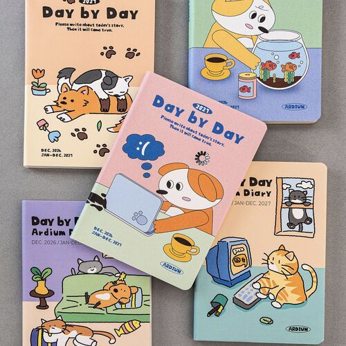 The Happy Puppies cover features an orange cat and black-and-white cat lounging together among flowers, paw prints, and colorful accents.