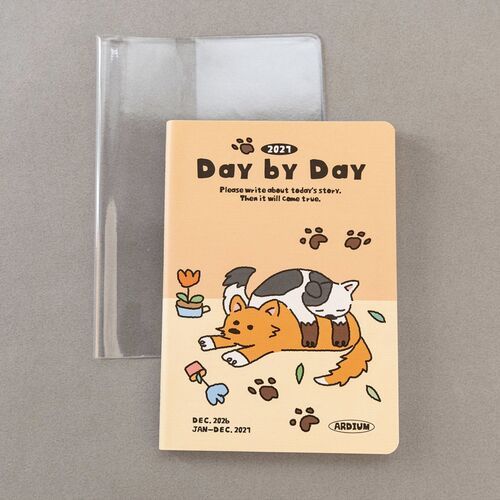 The daily spread includes date and topic headers, weekday markers, checklist circles, and wide lined sections for detailed writing.
