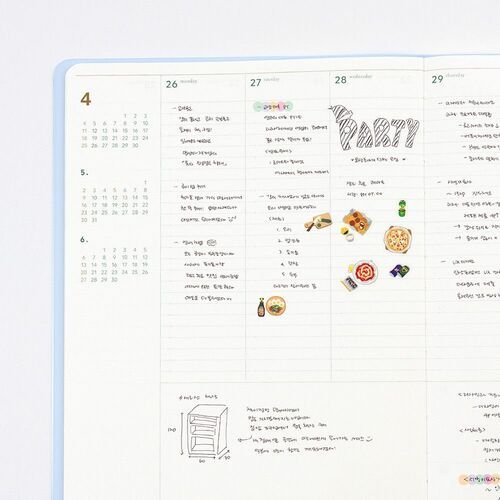 The planner lies open to a broad May spread with dated columns and ample lined writing space.